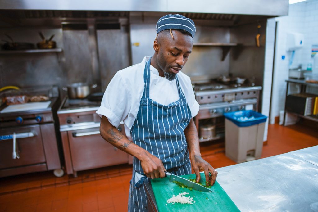 Why should you wear an apron in the kitchen